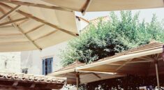 A group of tables with umbrellas on top of them